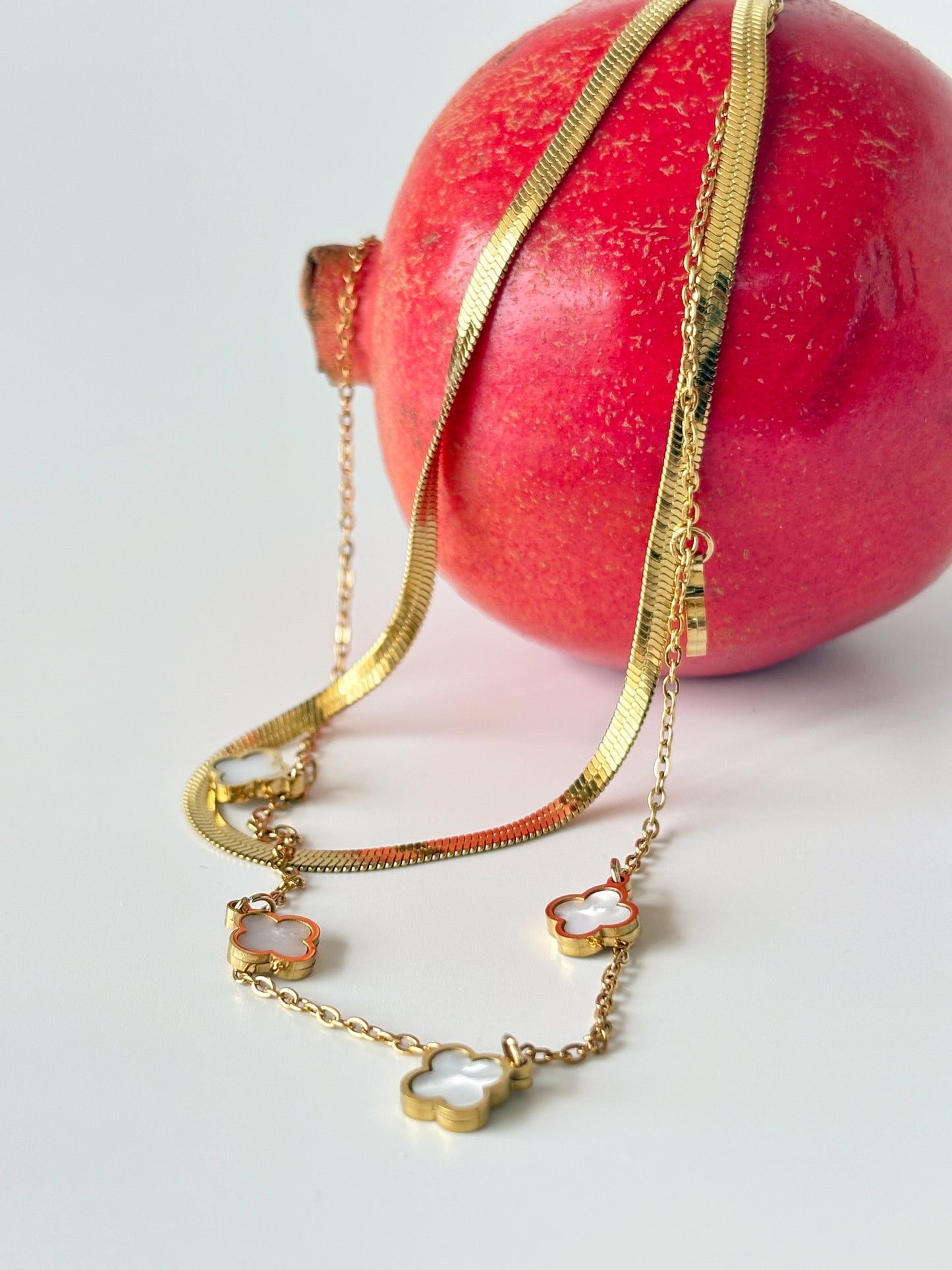 Gold necklace with clover charms