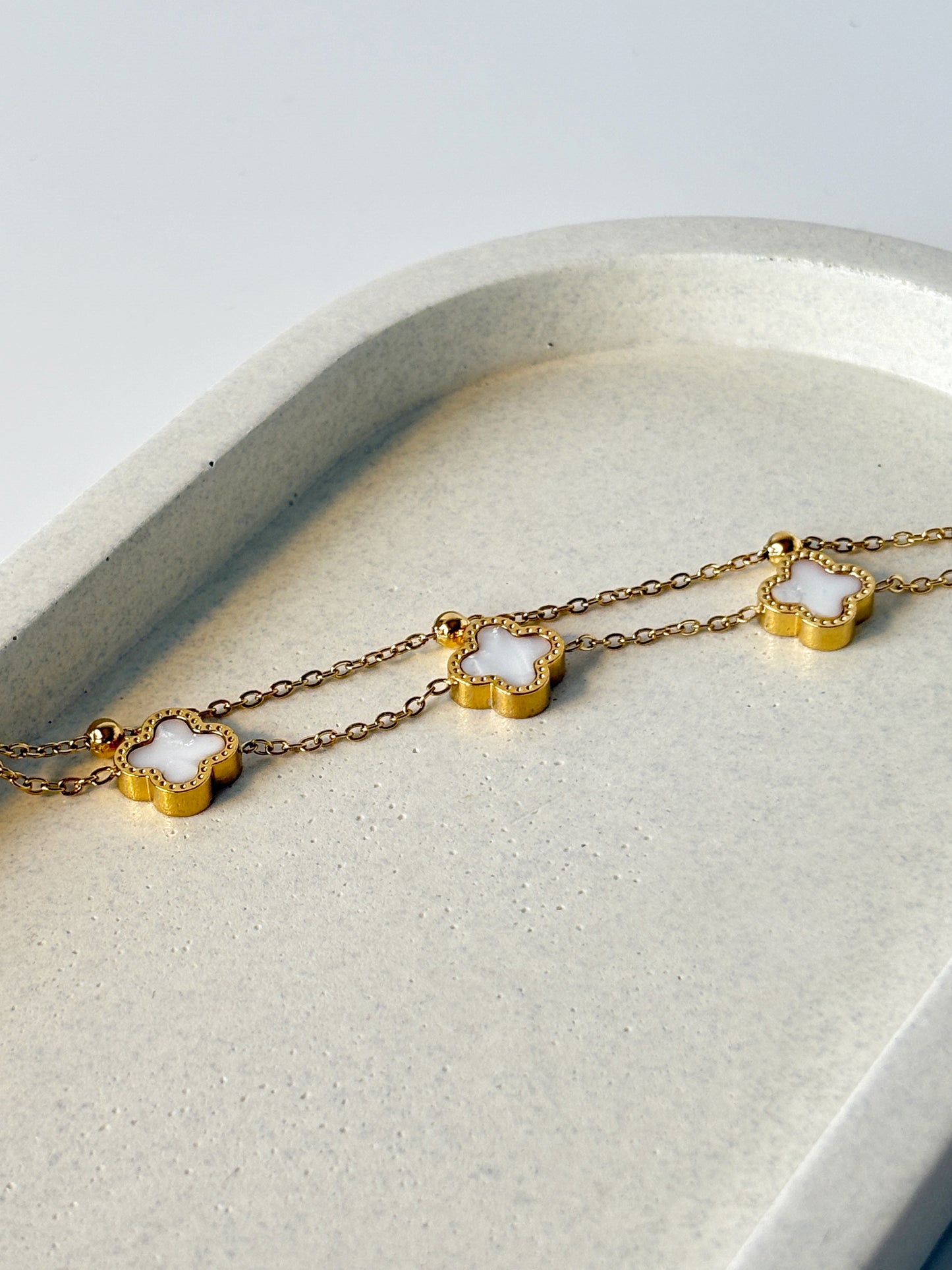 Gold bracelet with clover