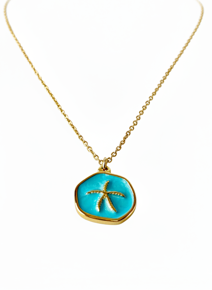 Necklace with a turquoise pendant featuring a starfish design on a white background