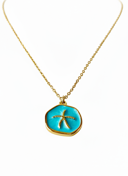 Necklace with a turquoise pendant featuring a starfish design on a white background