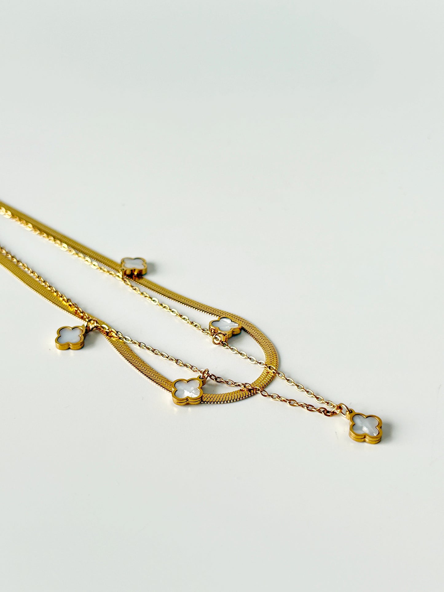 Gold necklace with clover charms