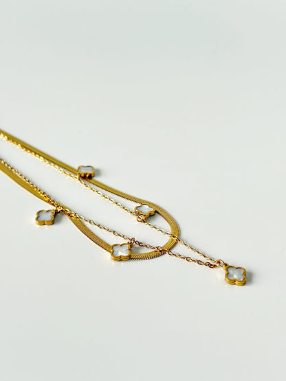 Gold necklace with clover charms