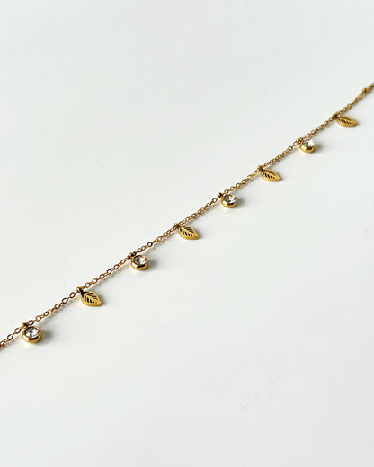 Gold bracelet with leaf-shaped pendants