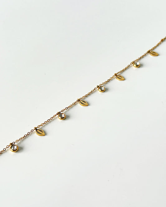 Gold bracelet with leaf-shaped pendants