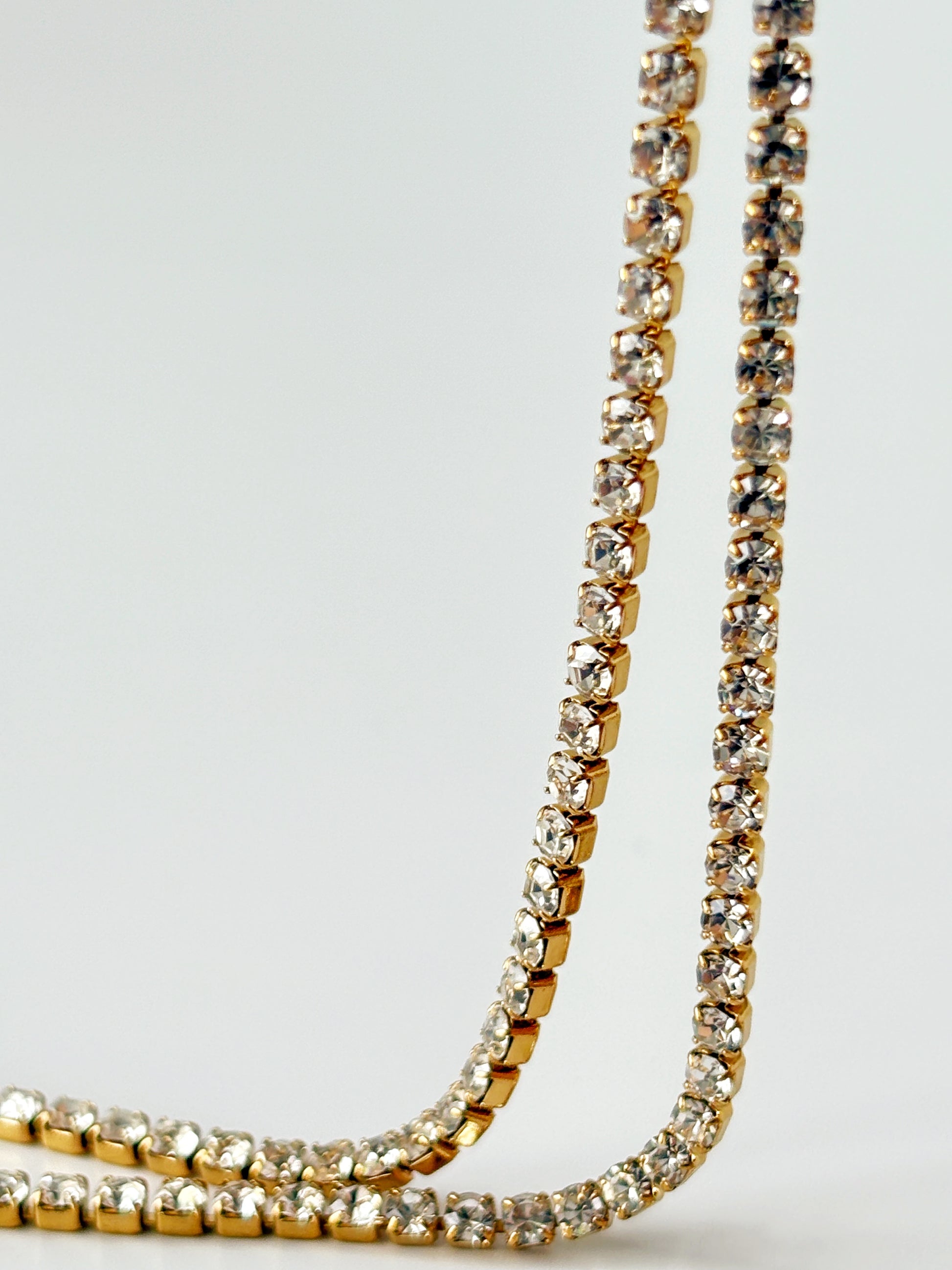 Gold and crystal tennis bracelet