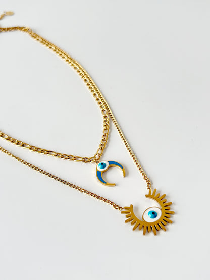 Two layered gold necklace with eye and crescent moon charms 